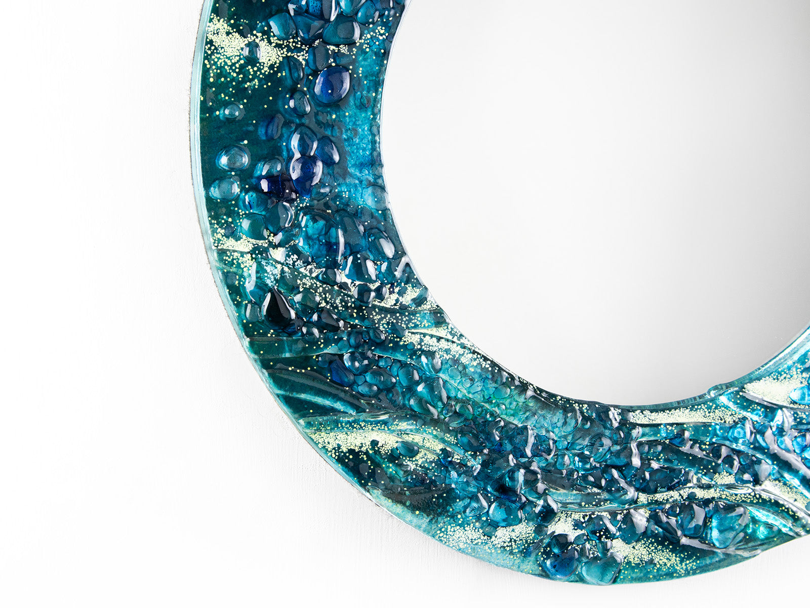 close-up fused glass round mirror wall art textured blue teal decor