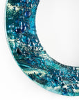 close-up fused glass round mirror wall art textured blue teal decor