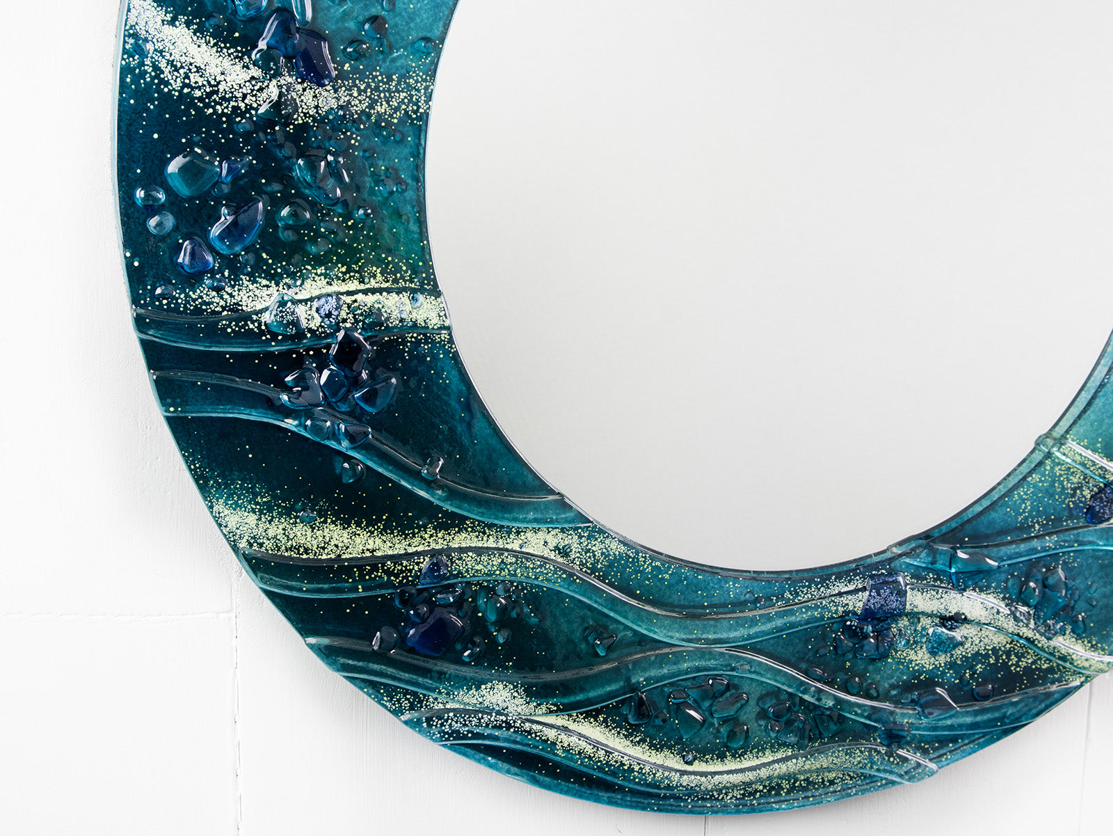 close-up fused glass round mirror wall art textured blue teal decor