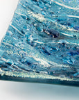 close-up of fused glass square bowl textured blue teal 