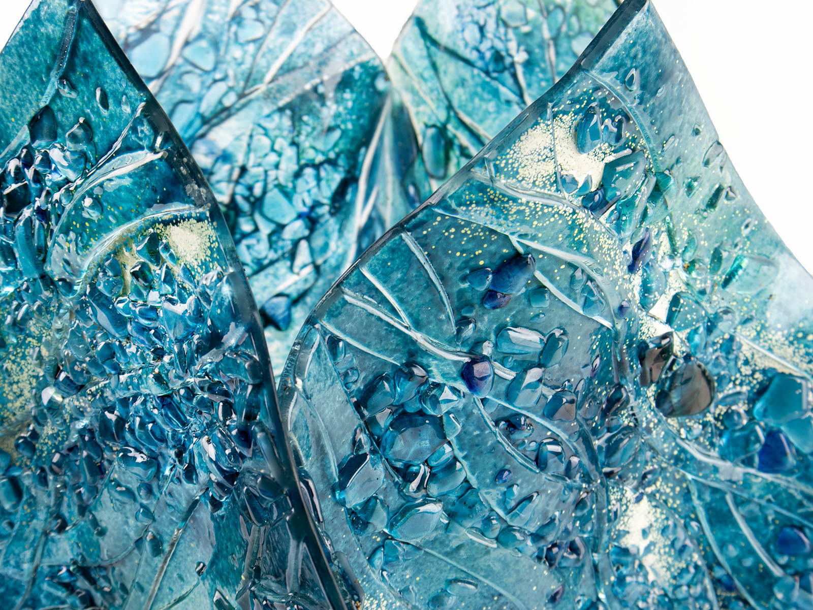 close-up fold form fused glass vase textured blue teal decor