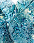 close-up fold form fused glass vase textured blue teal decor