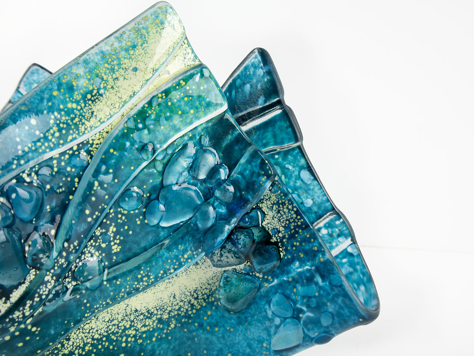 close-up fold form fused glass blue teal textured detail