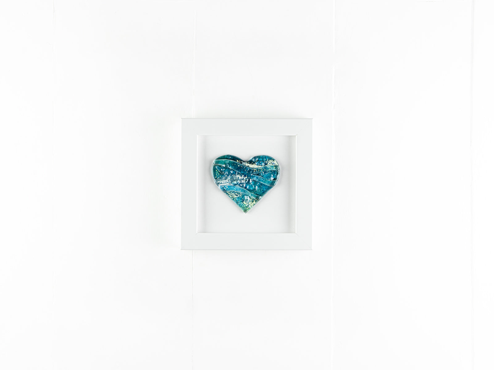 Heart shaped fused glass art on a small square frame blue teal