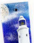 Close up of fused glass wall panel with lighthouse and moon design in coastal colours. Handmade glass panel, designed in Cornwall. 