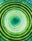 Close up shot of fused glass extra large dish made with ocean teals and greens with glass texture. Handmade in Cornwall, Launceston. 