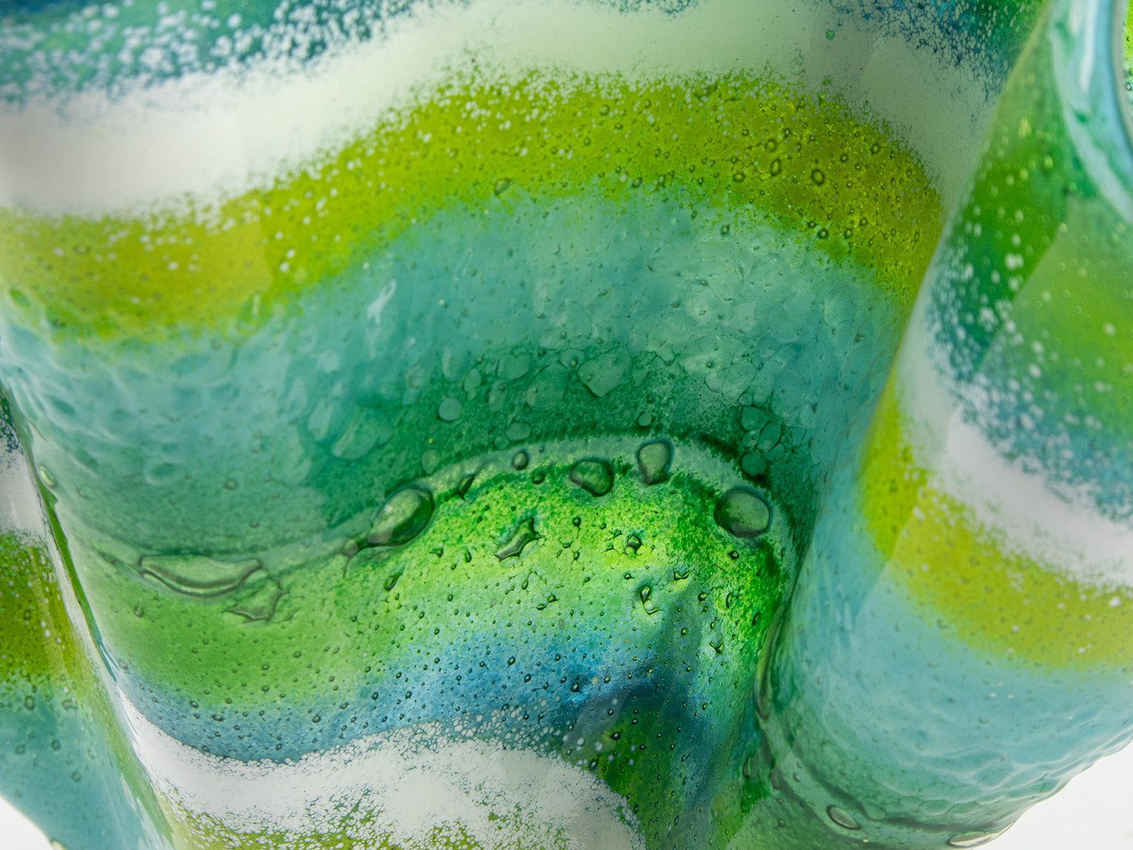 Close up of fused glass extra large vase handmade in Cornish studio in coastal green colours. Stunning homeware piece of sculptural glass. 