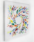 Individually hand-cut fused glass fish in rainbow hues on a white art frame.