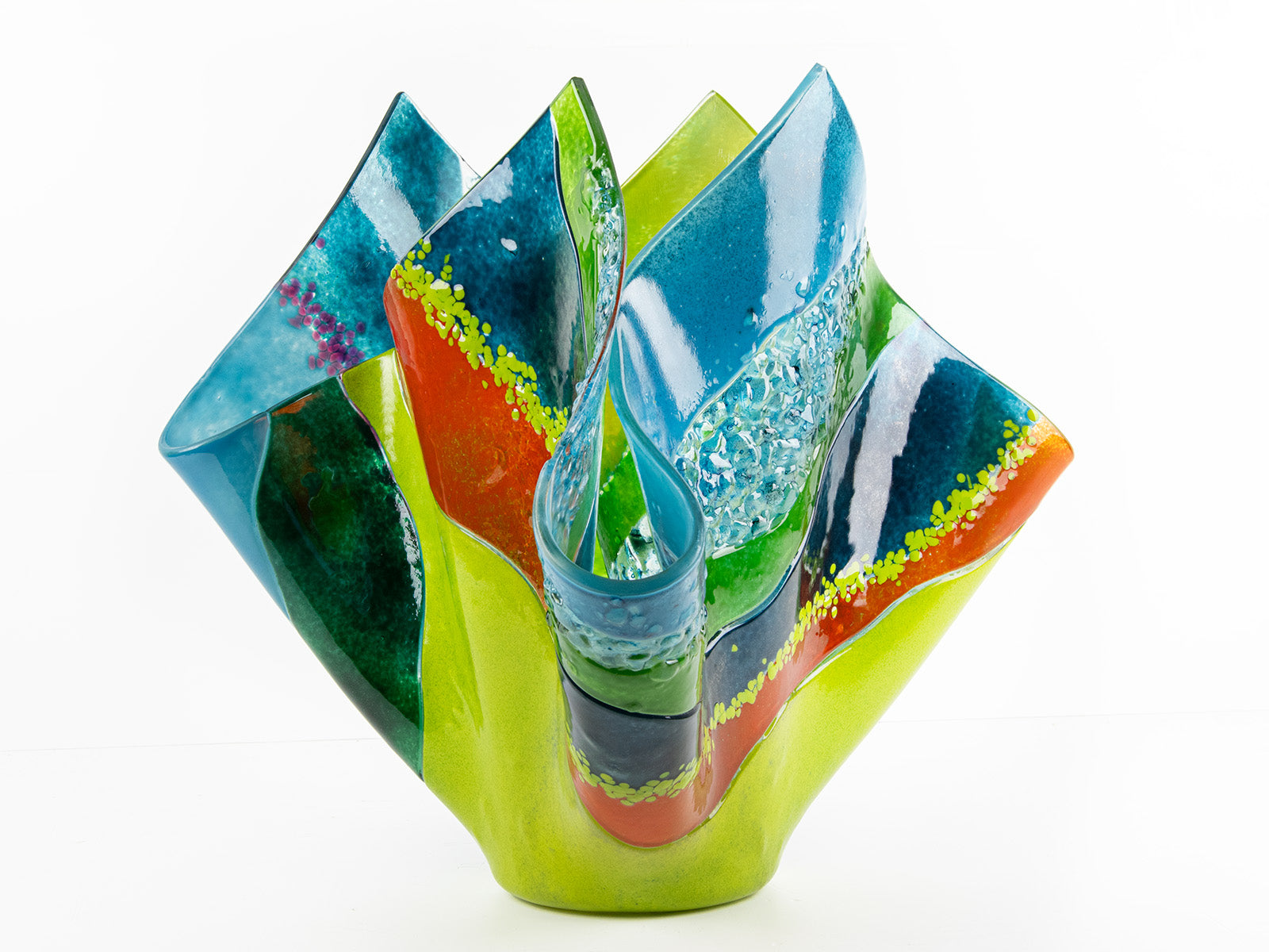 Third image of fused glass fold form vase, with bright greens and textural detailing. 