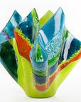 Third image of fused glass fold form vase, with bright greens and textural detailing. 