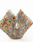 A fold form fused glass vase, made with recycled crushed glass in warm colours to create a stunning piece of art.
