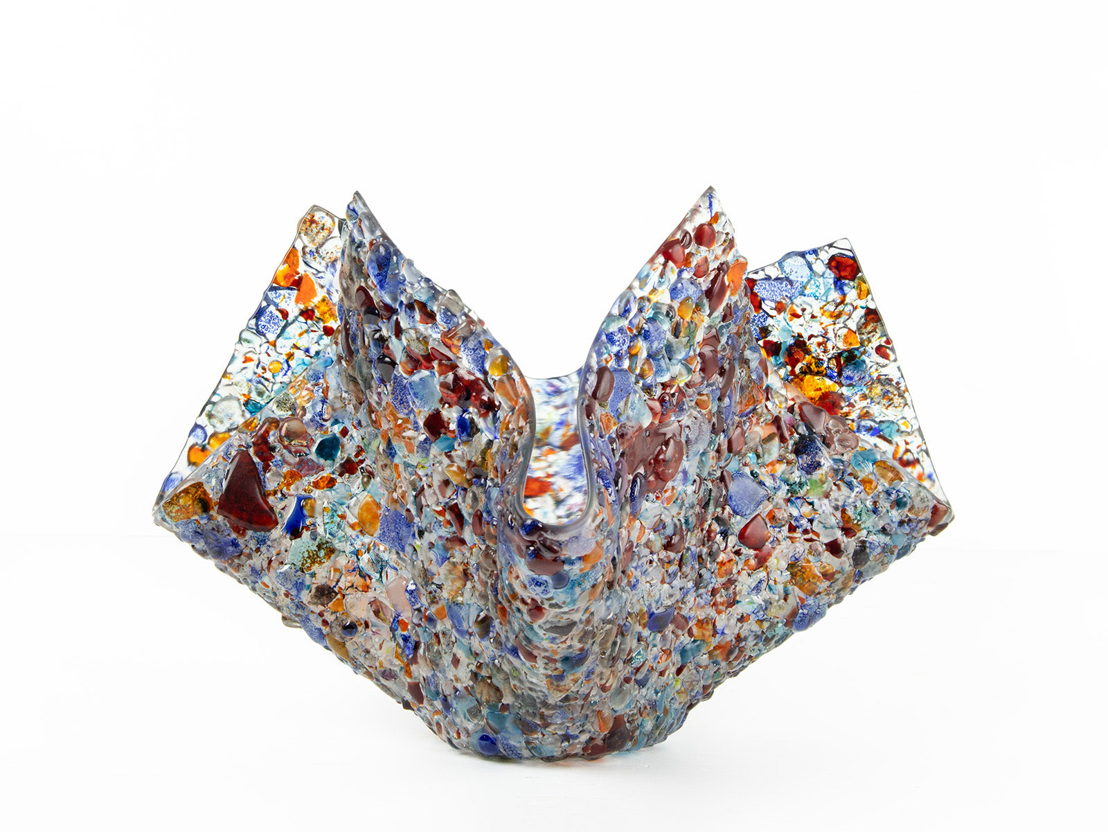 fold form fused glass vase in multi colours and textured detail.