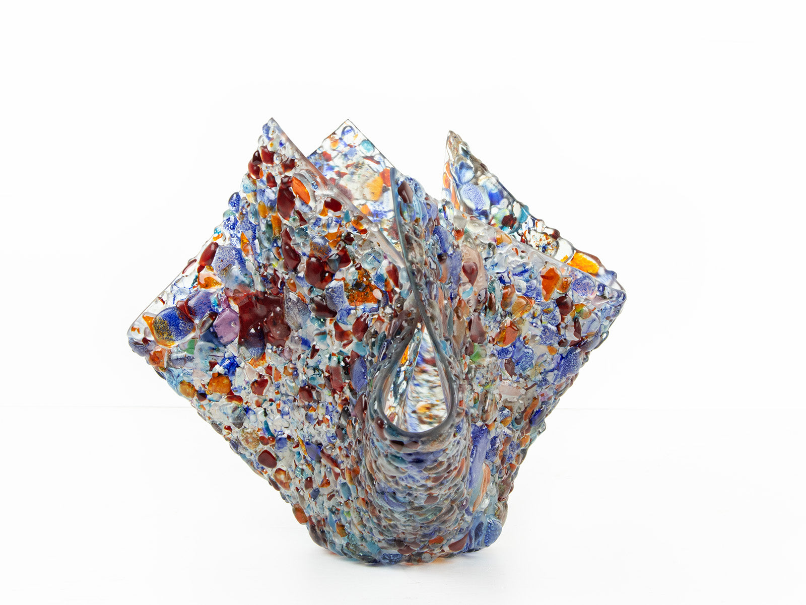 A fold form fused glass vase, handmade using recycled glass in vibrant colours. 