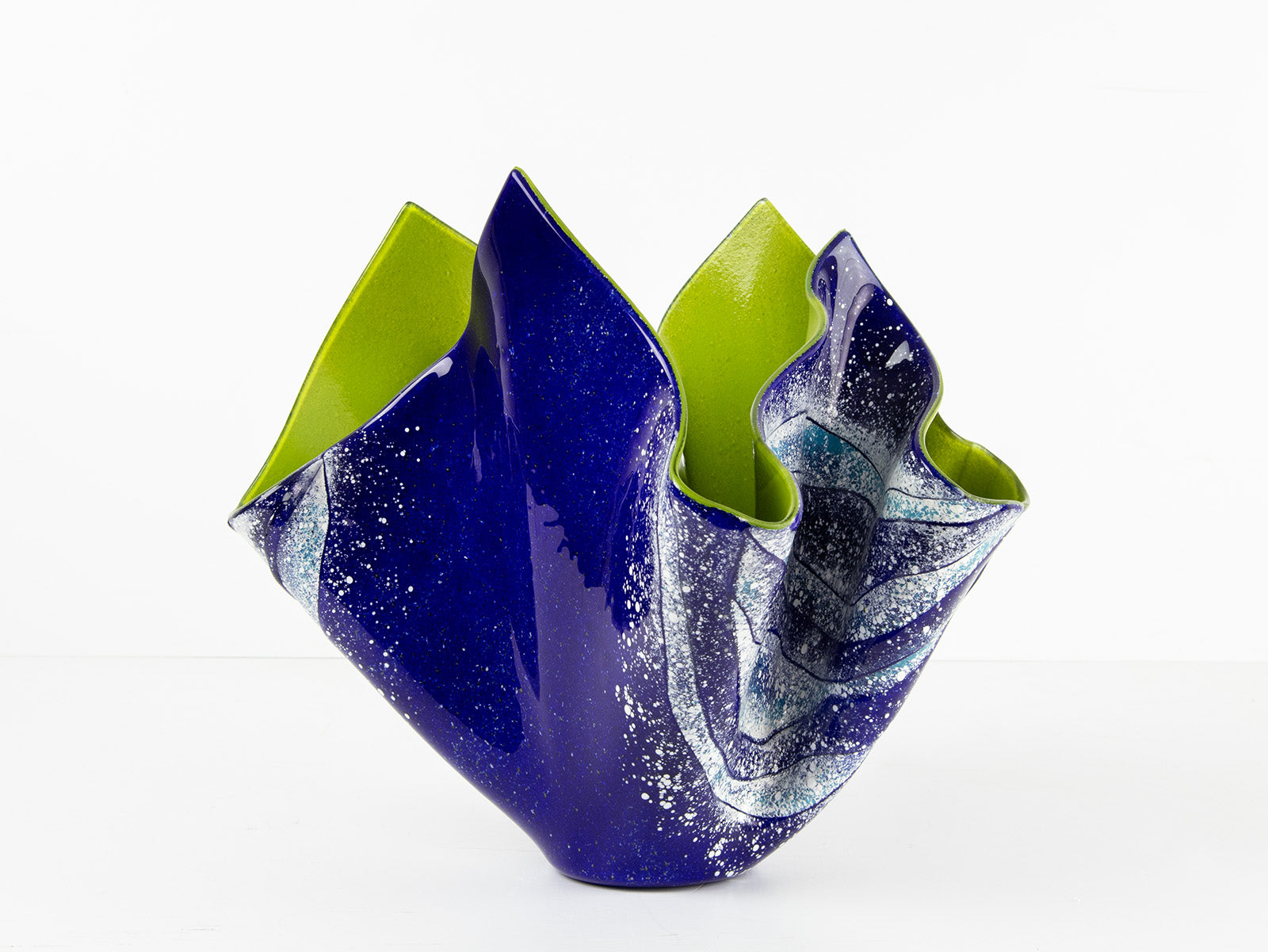 Opaque ocean inspired fused glass fold form vase with bright coastal colours and texture. 