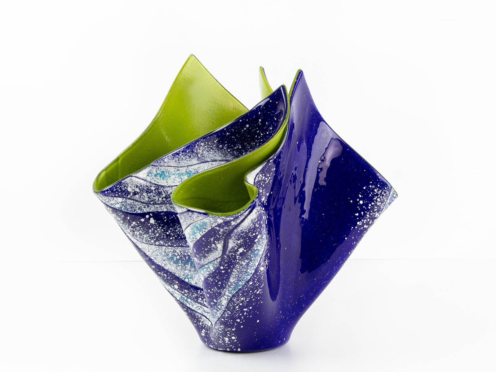 Opaque ocean inspired fused glass fold form vase with bright coastal colours and texture. 