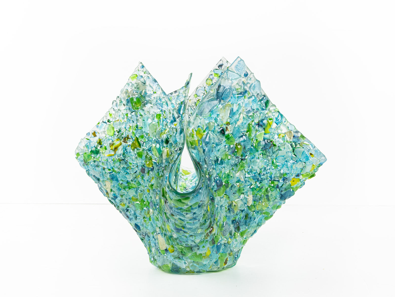 Side image of fused glass large vase, handmade from recycled glass in ocean green and blue hues. 