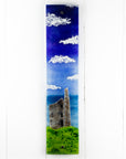 Fused glass wall panel featuring a Cornish lighthouse sat against a coastal blue design.  
