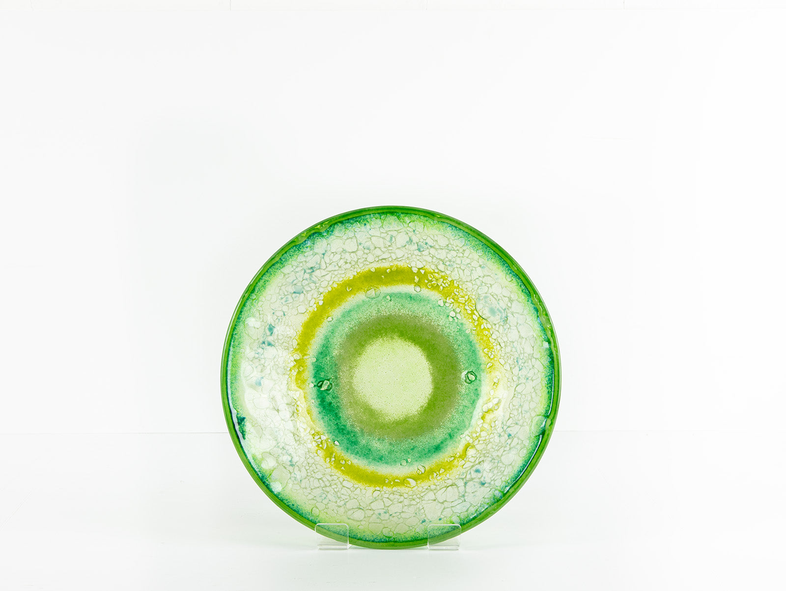 Fused glass round dish featuring a soft sea green colour-way with organic detailing.