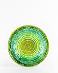 Fused glass round dish, featuring an emerald green colour-way and swirling design. 