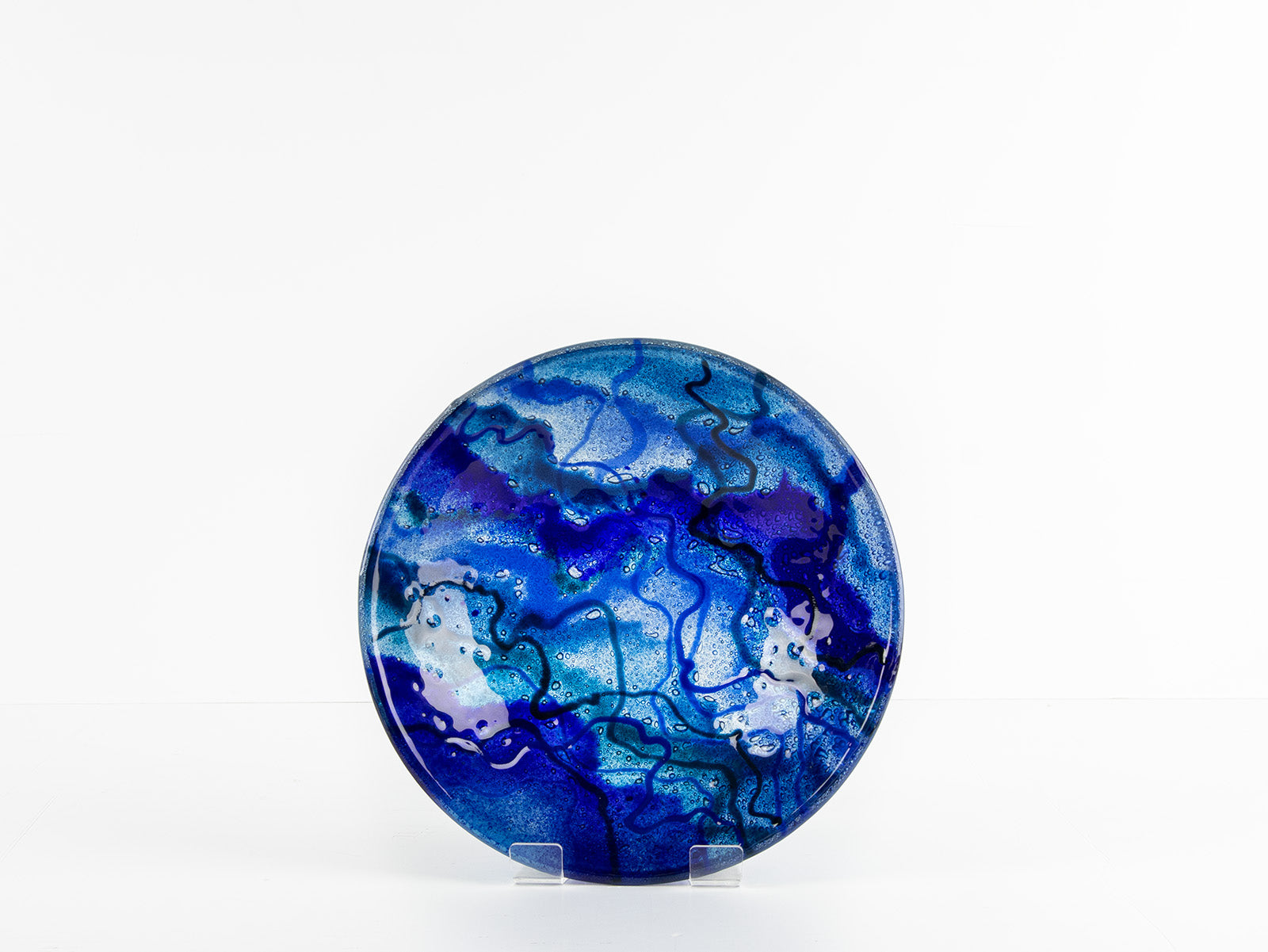Fused glass round dish, featuring ocean blue colours and organic detail. 