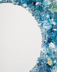 Details of fused glass round mirror, made from recycled glass in coastal blues. 