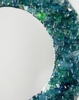 Details of fused glass round mirror, made from recycled glass in coastal greens