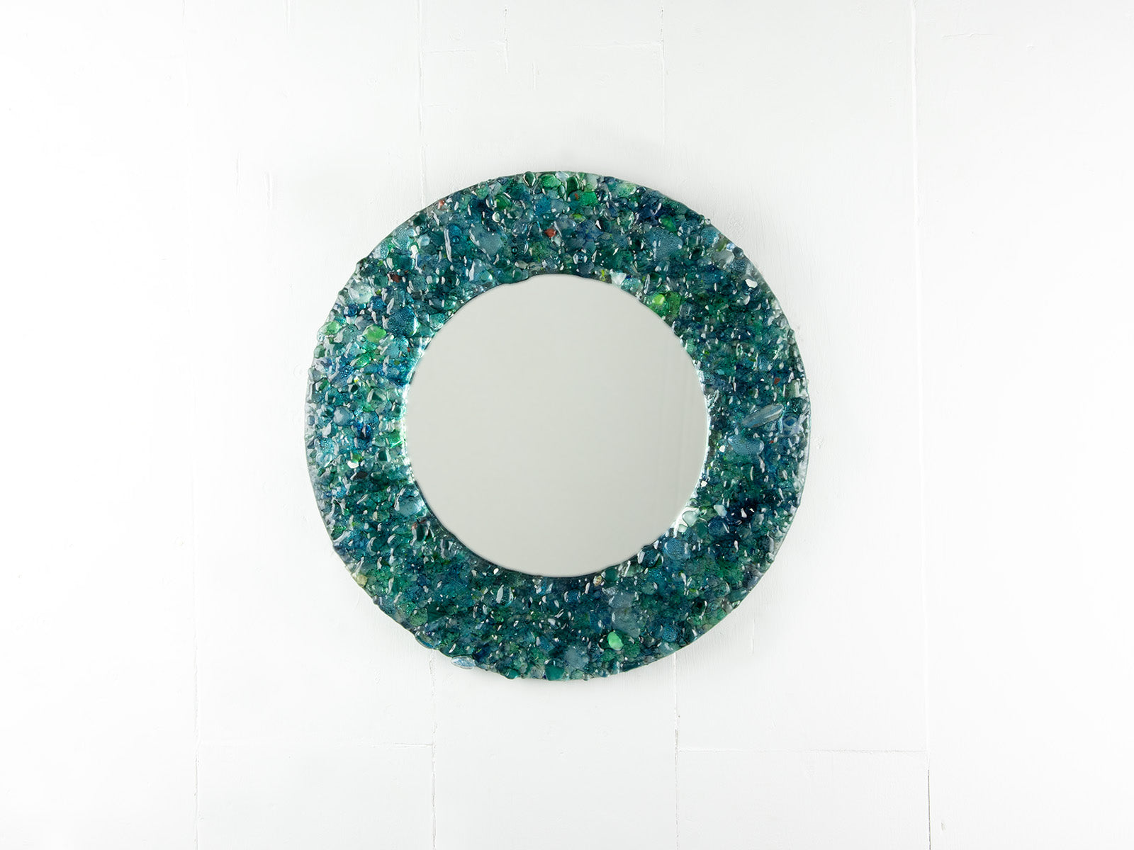 Fused glass round mirror, made from recycled glass in coastal greens