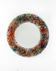 Fused glass round mirror, made from recycled glass in sunset orange and reds