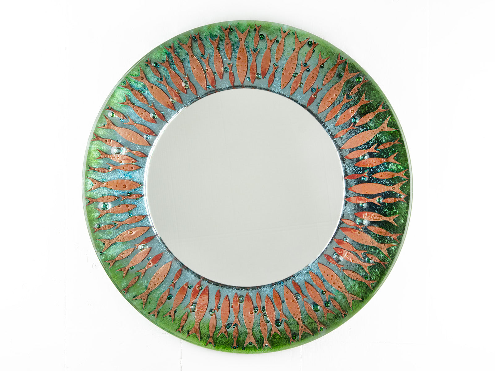 Fused glass round mirror featuring a soft, coastal colour-way with copper fish, creating an ocean inspired piece of wall art.