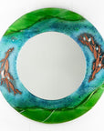 Fused glass round mirror, featuring coastal design in sea greens and blues with copper fish. 