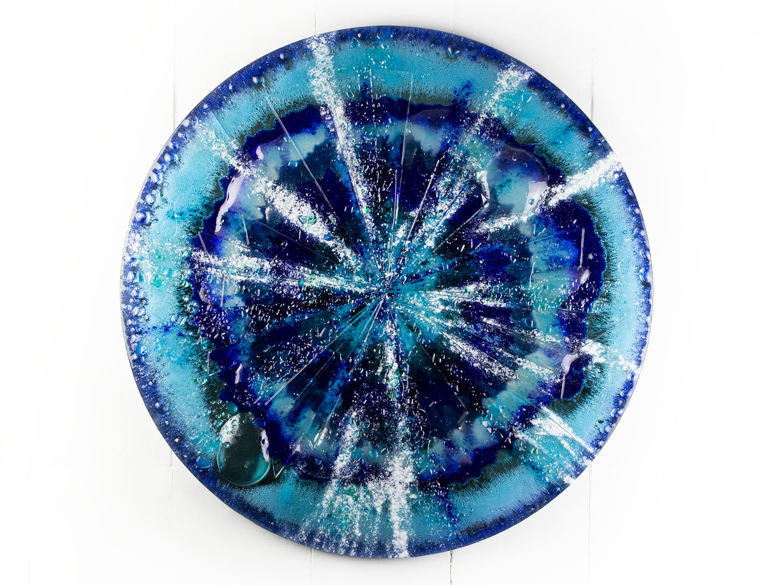 Fused glass round panel, designed in sea blues and organic textural detailing. 