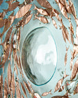Detail of giant bubbled on a fused glass round panel with copper fish and teal blue design. 