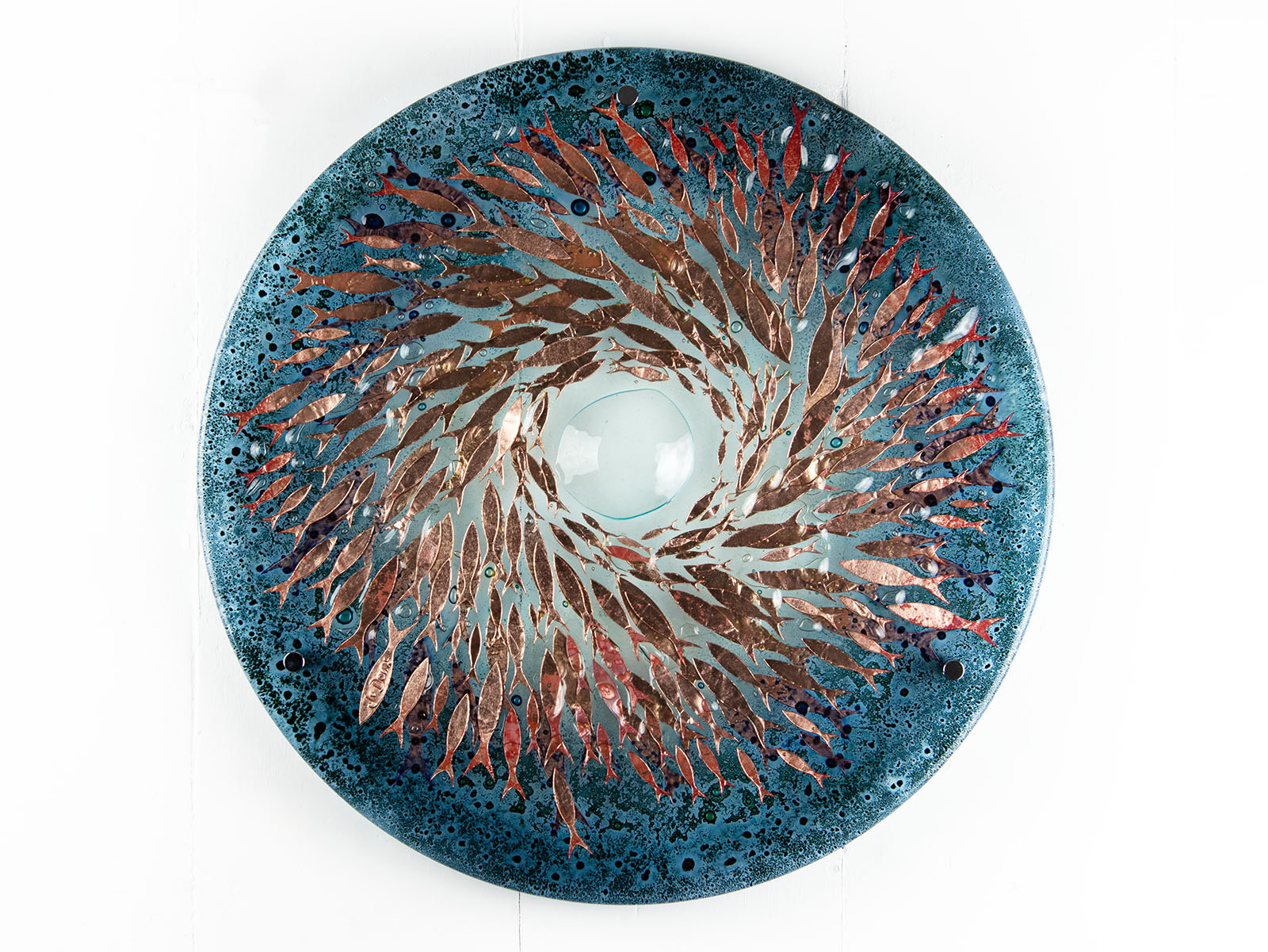 Fused glass round panel with copper fish detail and a ocean teal colour-way.