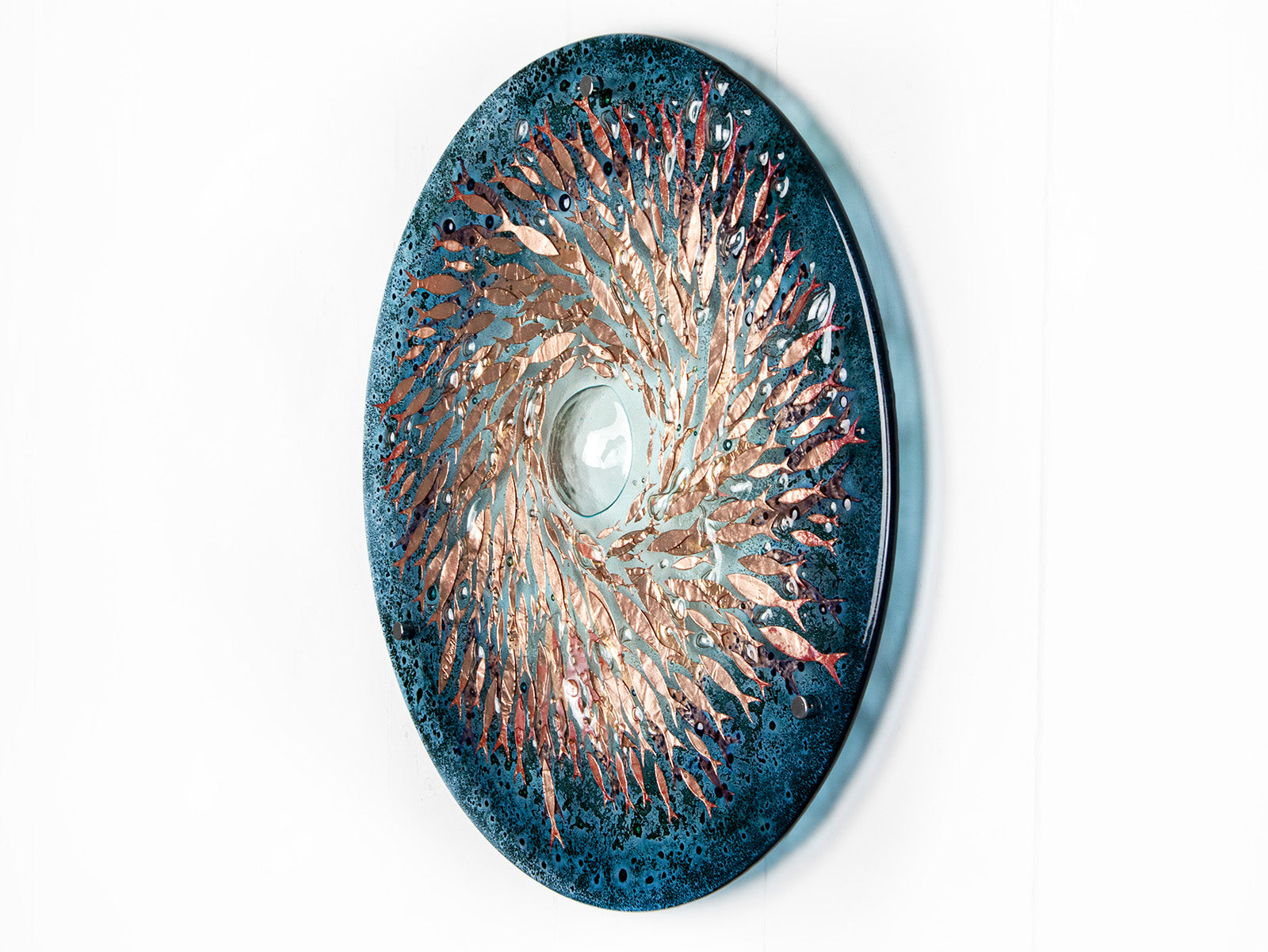 Fused glass round panel with copper fish detail and a ocean teal colour-way.