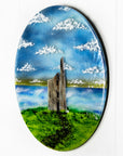 Side on image of fused glass round wall panel, featuring Cornish Tin Mine, in coastal design. 