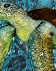 Details of a turtle design on a fused glass round panel with aqua bubbled background. An ocean inspired piece of wall art. 