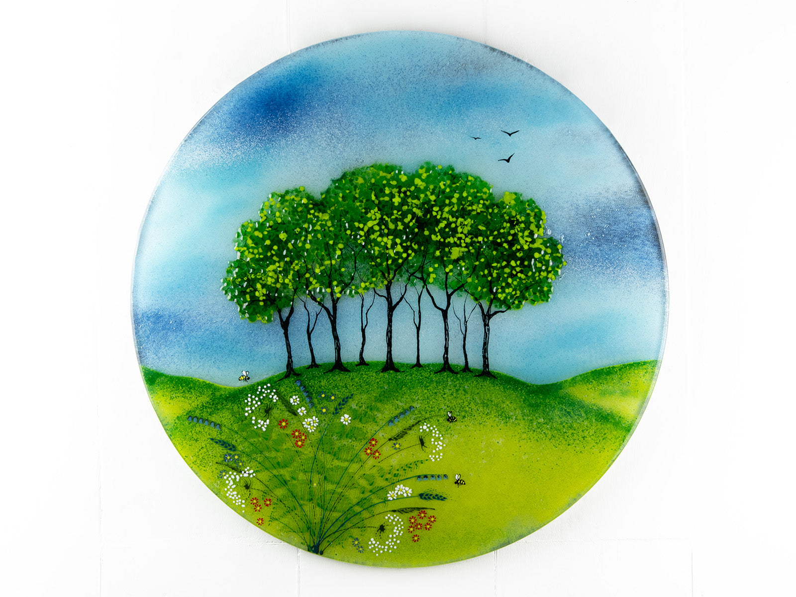 Fused glass round panel, inspired by the Nearly Home Trees in Devon, designed in bright summer greens. 