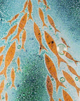 Close up of fused glass square wall panel, featuring sea green colours and copper fish detailing. 