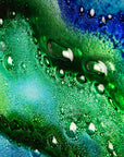 Bubbled details on abstract and bright fused glass wall panel, inspired by the ocean with coastal colours.