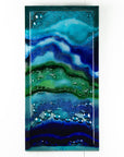 Abstract and bright fused glass wall panel, inspired by the ocean with coastal colours and bubbled detailing. 