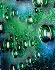Close up of abstract and bright fused glass wall panel, inspired by the ocean, with coastal colours and bubbled detail. 