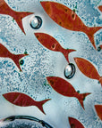 Copper fish details on fused glass wall panel, with marine blue colours. 