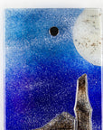 Close up of small fused glass wall panel, featuring a Cornish tin mine design, with a coastal moonlight sky. 