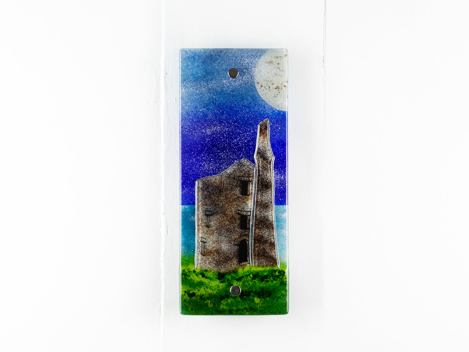 Small fused glass wall panel, featuring a Cornish tin mine design, with a coastal moonlight sky. 