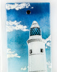 Close up of fused glass wall panel, made with a lighthouse design by the coast. Stunning coastal hues, a stunning hand-made piece of wall art. 