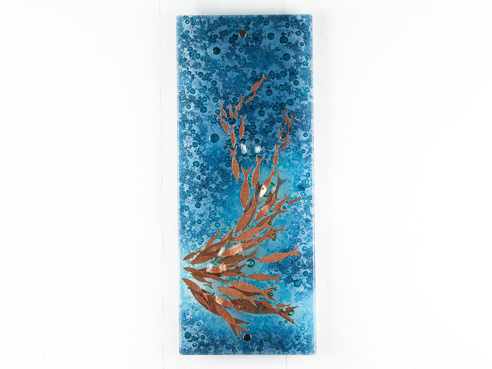 Fused glass wall panel with bubbled blue colours and swimming copper fish. An organic and ocean inspired piece of wall art. 