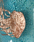 Details of hand-etched copper jellyfish on a fused glass wall panel, inspired by the coast. 