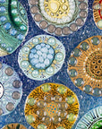 Close up of fused glass wall panel, designed with organic textural detail and aqua, marine blues.