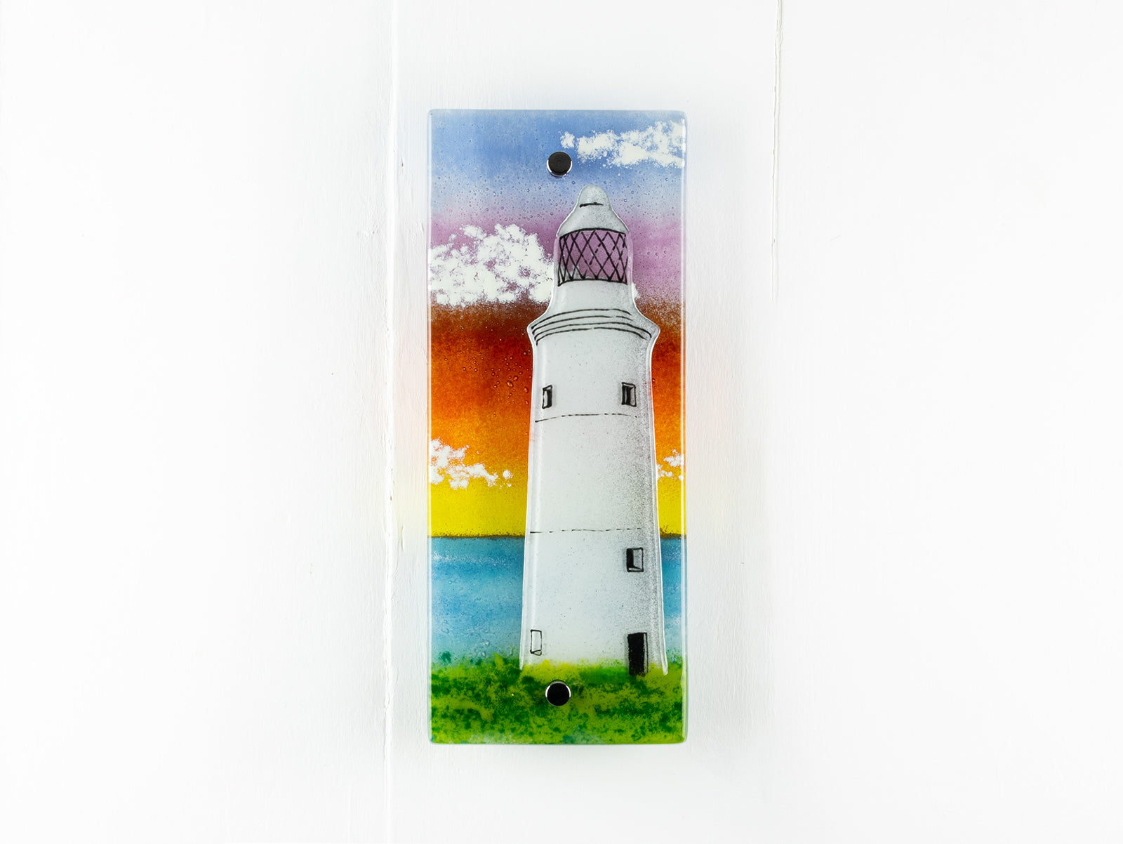 Handmade wall panel featuring a lighthouse with bright sunset colours. Gorgeous Artisan wall art piece, designed in Cornwall. 