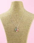 Fused glass pendant necklace, handmade in sea greens and rose pinks, hung on sterling silver chain. 